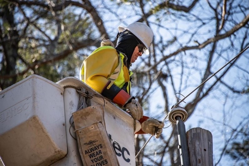 An working on an electrical grid